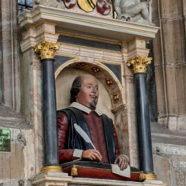 The funerary monument of William Shakespeare on the north wall of the chancel of Holy Trinity Church, Stratford-upon-Avon. The effigy of Shakespeare is painted limestone; the elaborate monument is constructed of alabaster, marble and sandstone and was made around his death in 1616.